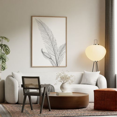 Modern living room with white sofa, wooden coffee table, and decorative wall art.