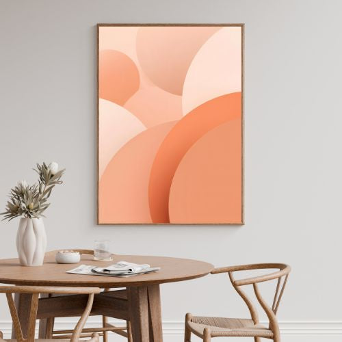 Dining room with a round wooden table, chairs, and abstract art on the wall.