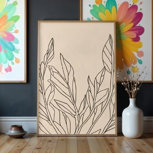 Framed artwork with leaf design on a wall with colorful abstract art