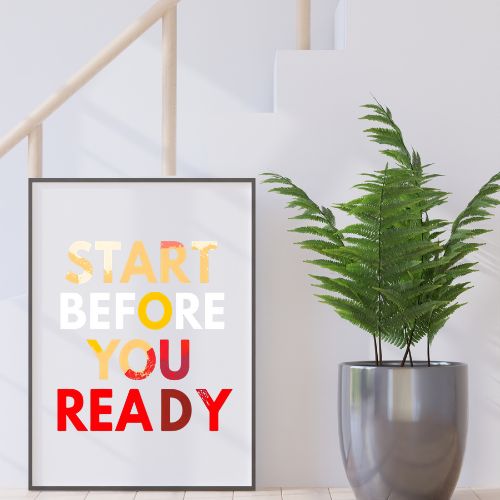 Framed motivational poster with text 'Start Before You Ready' next to a potted plant indoors.