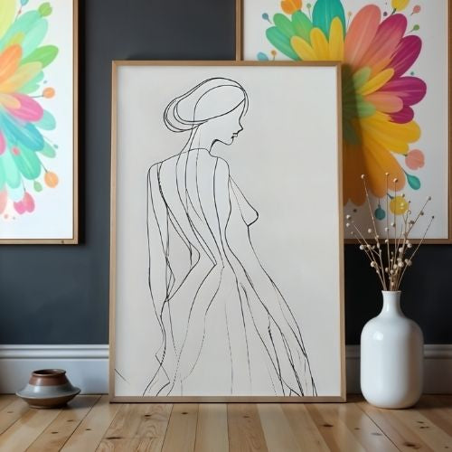 Framed line art of a woman's silhouette in a room with colorful floral artwork and decor items.