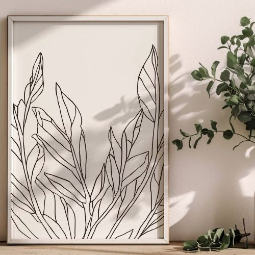 Framed botanical line art on a wall with a plant