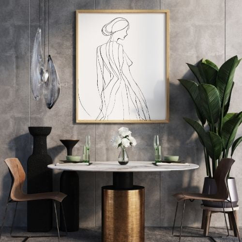 Modern interior with marble table, decorative vases, and framed artwork on a gray wall.