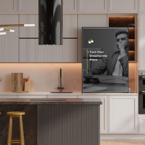 Modern kitchen with a mounted TV displaying an inspirational quote.