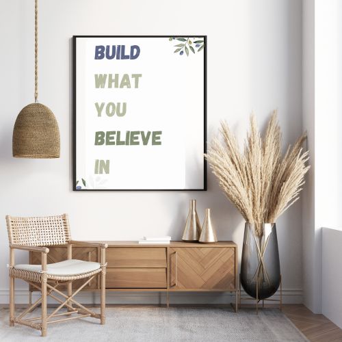 Modern interior with a wooden sideboard, rattan chair, and decorative vase with dried plants.